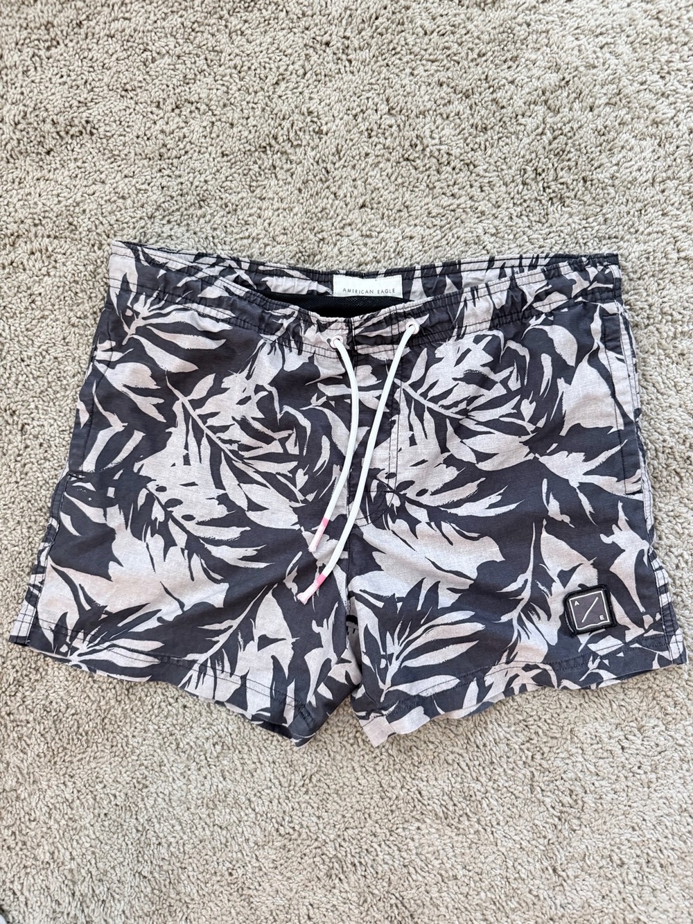 American Eagle Outfitters Men’s Black and Cream Leaf-Print Swim Trunks